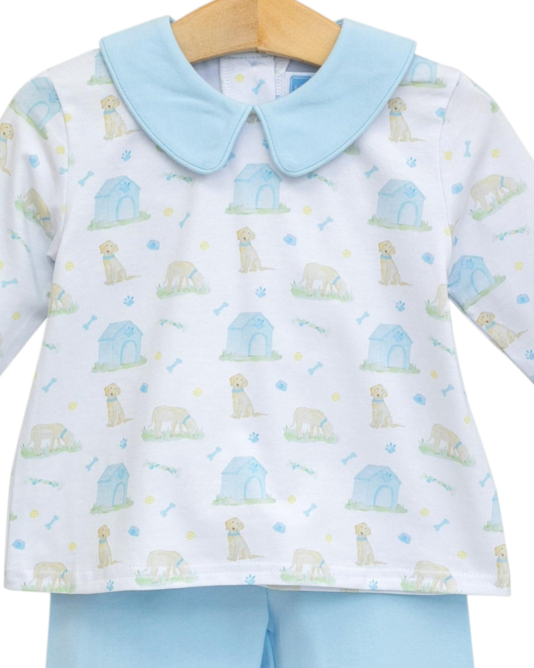 Baby outfit with long-sleeve shirt and pants featuring dog print on a white background