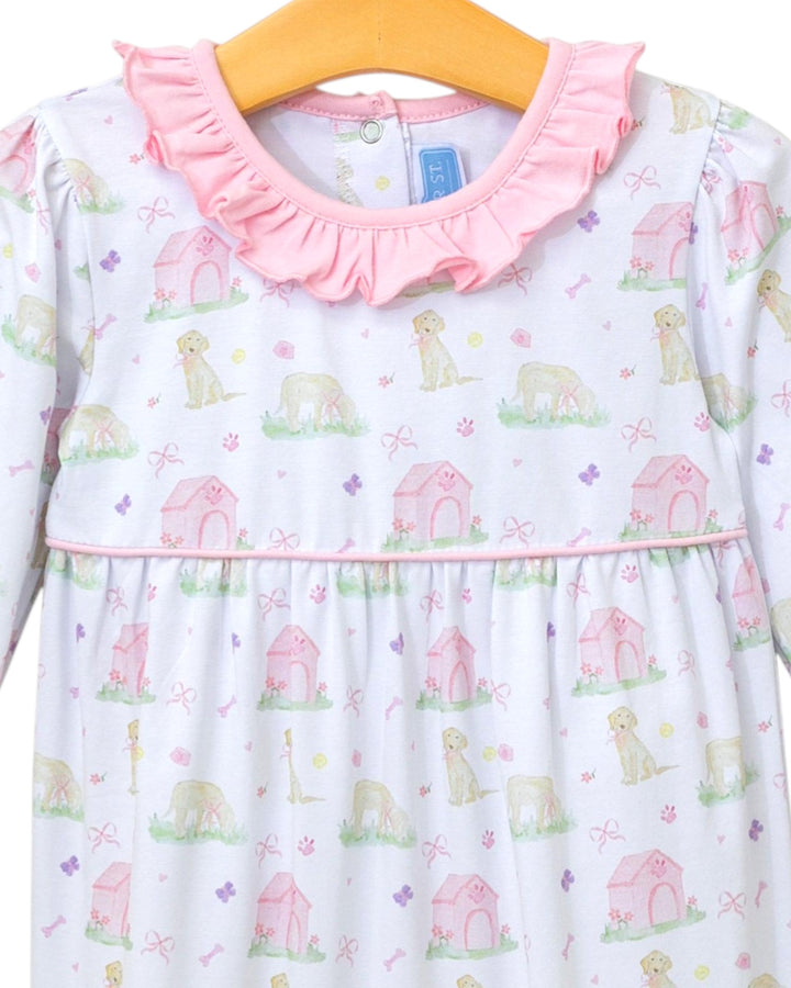 Children's dress with dog print and pink collar on a hanger