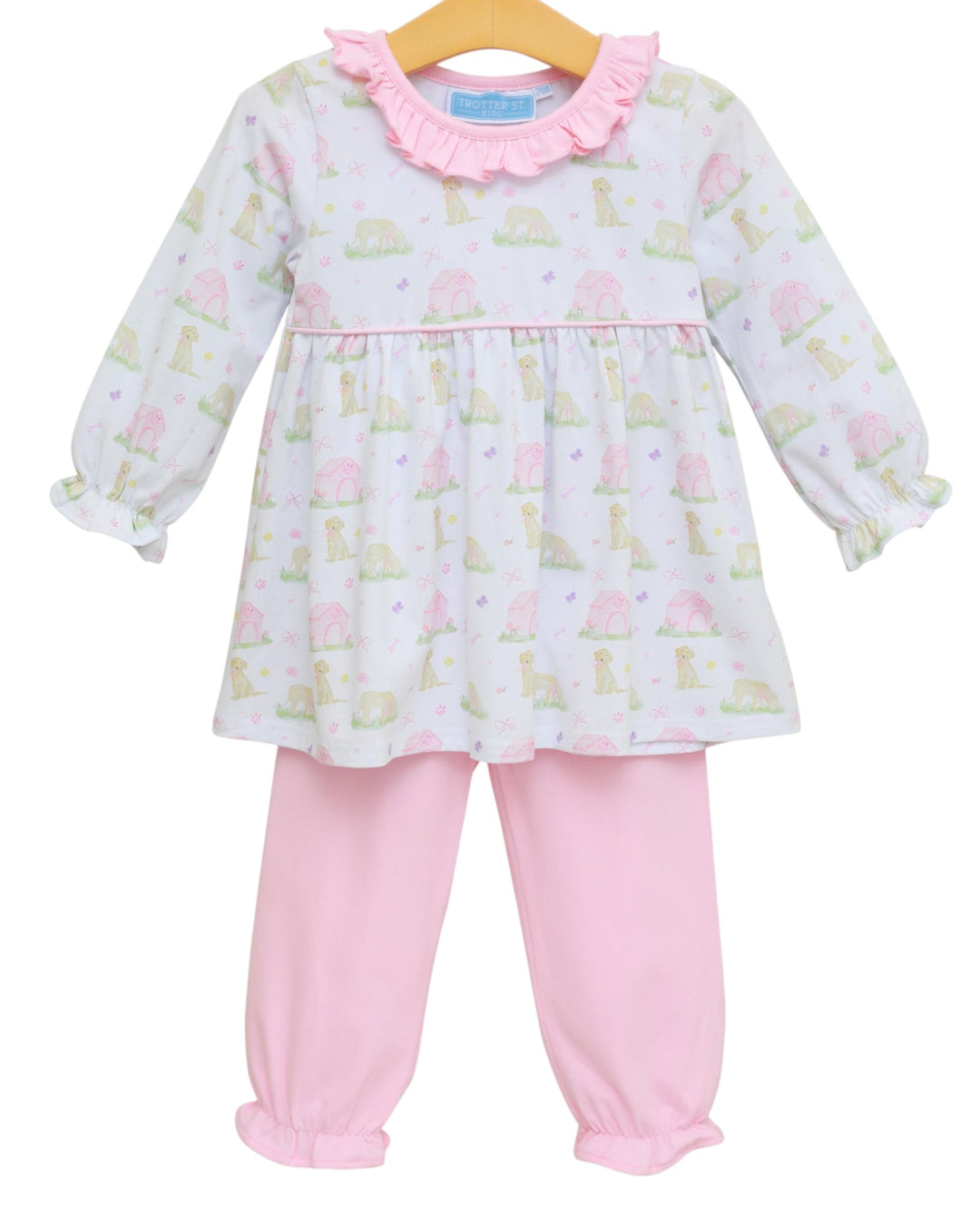Baby girl's outfit with a patterned top and pink pants on a white background