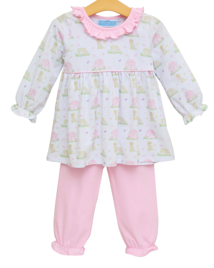 Baby girl's outfit with a patterned top and pink pants on a white background