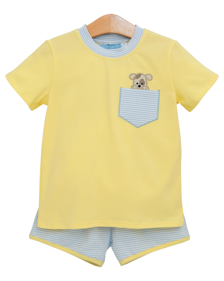 Yellow t-shirt with a puppy appliqué  design and matching shorts on a hanger against a white background
