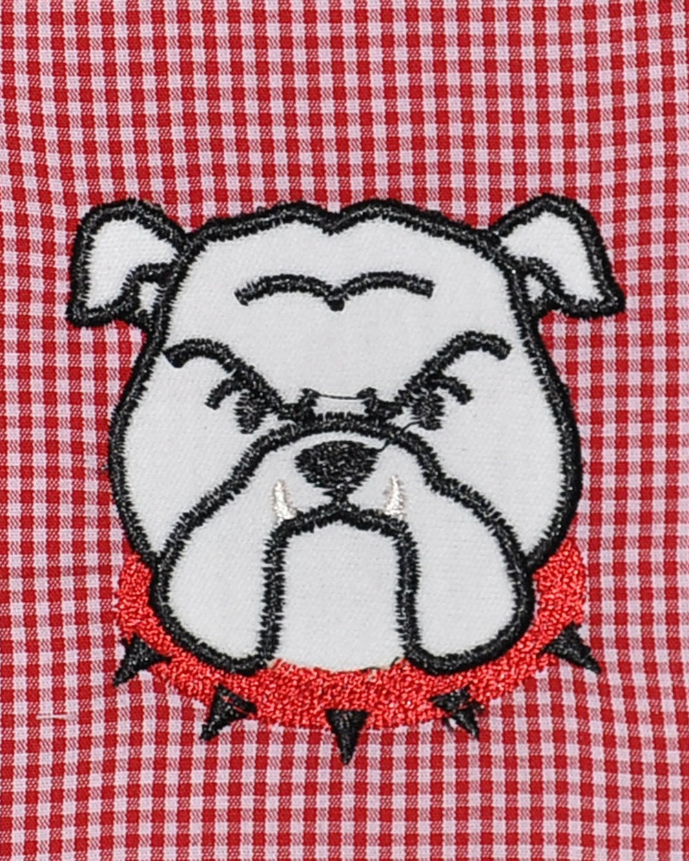 Embroidered bulldog face on a red and white checkered fabric