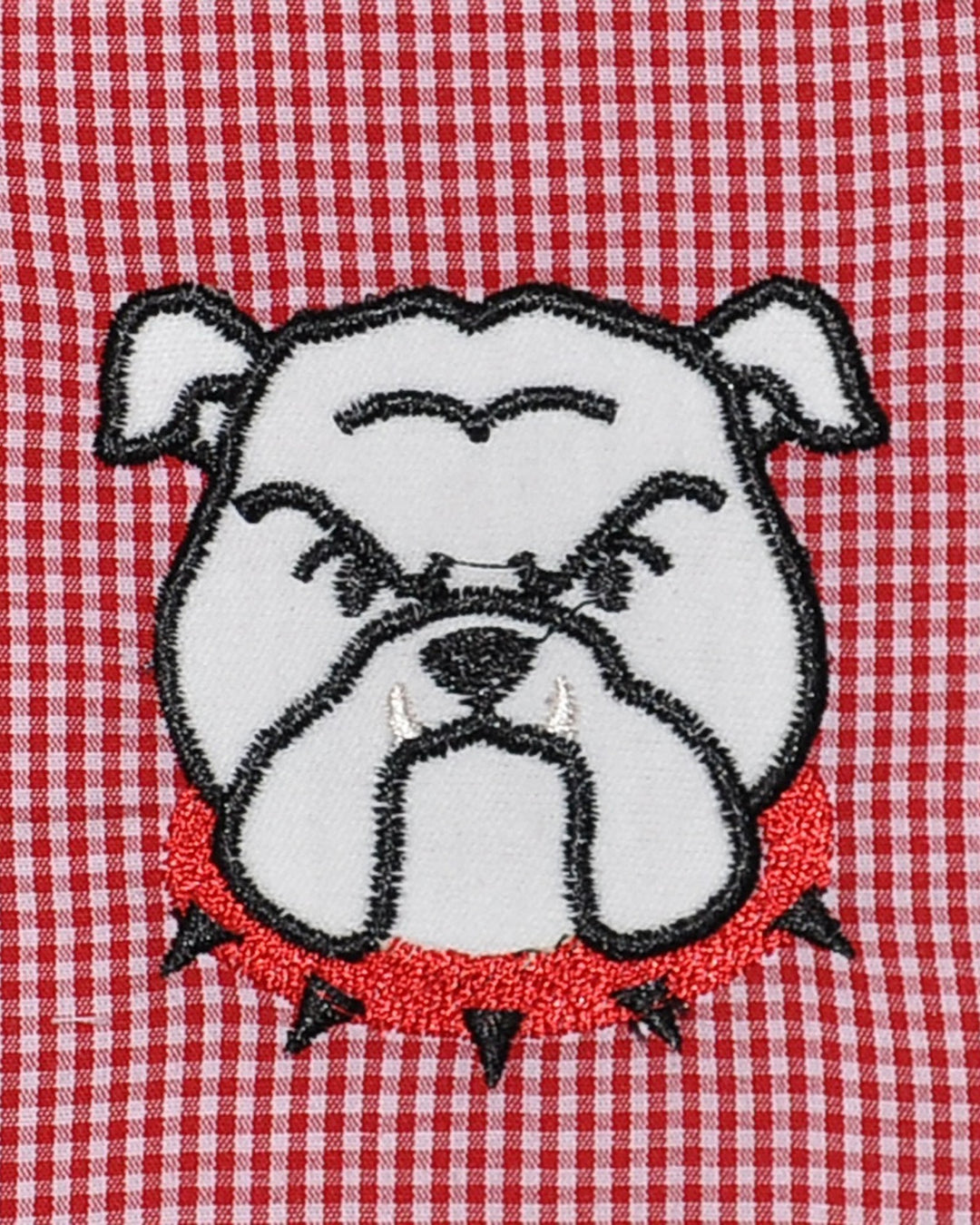 Embroidered bulldog face on a red and white checkered fabric