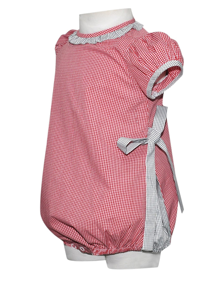 Red checkered dress with white trim on a mannequin against a white background