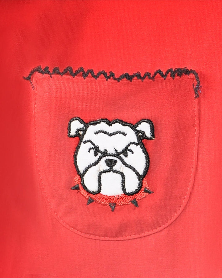 Embroidered bulldog design on a red fabric background