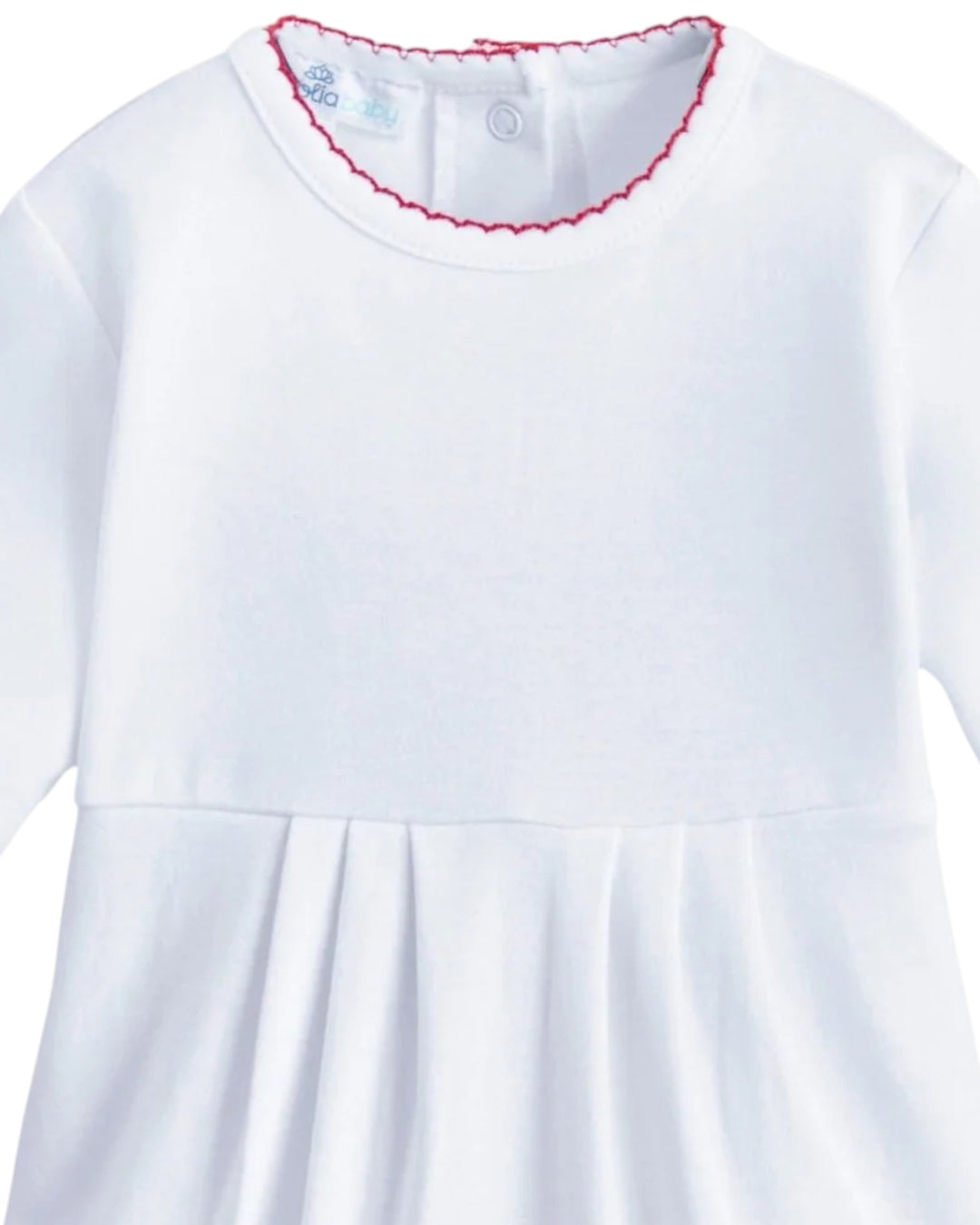 White dress with red trim on a white background