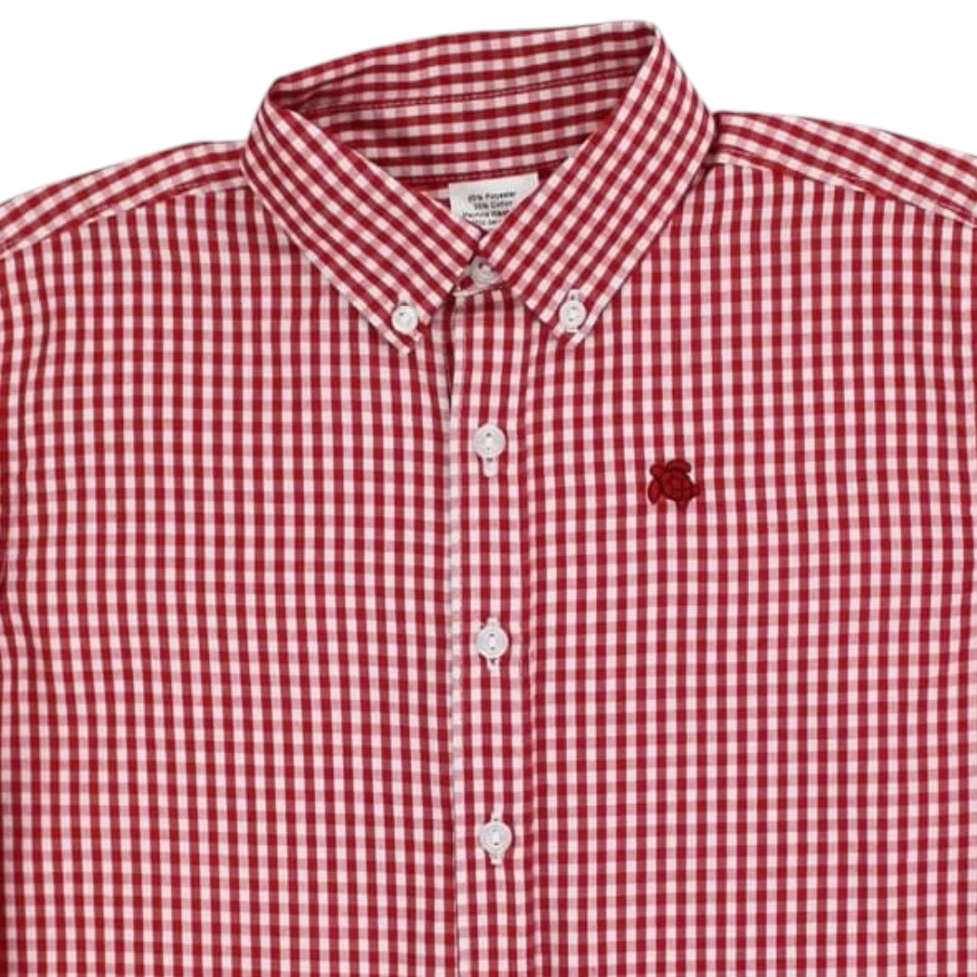 Red and white gingham button-down shirt with a small embroidered red logo on the left chest, shown on a white background, that store