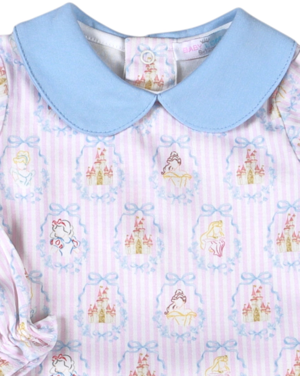 A close-up of a children's dress featuring a light blue Peter Pan collar and a pink and white striped body with a repeating pattern of fairytale characters in pastel colors, that store
