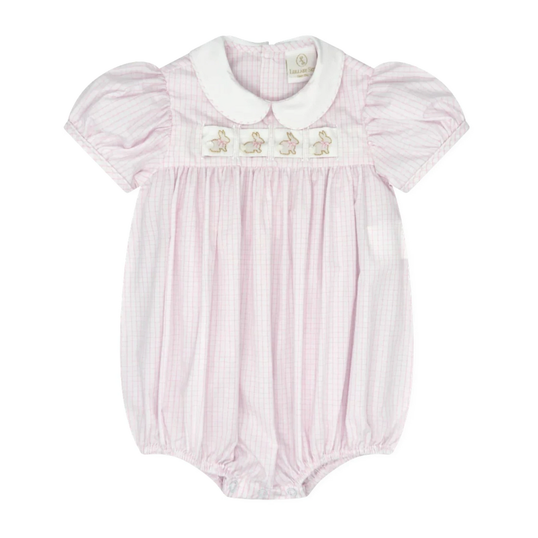 Pink baby romper with white collar and embroidered details on a white background