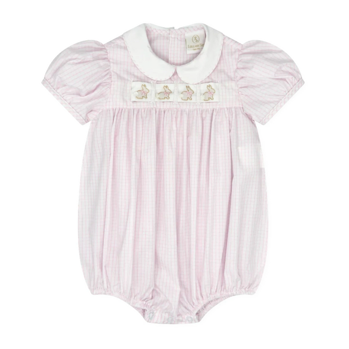 Pink baby romper with white collar and embroidered details on a white background