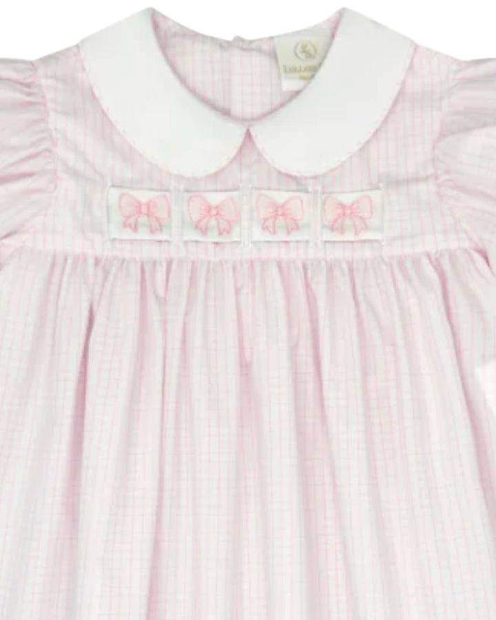 Pink and white striped dress with embroidered details on a white background