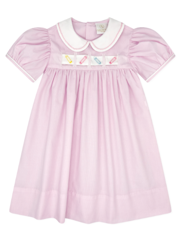 A light pink baby dress with a white Peter Pan collar, short puff sleeves, and a smocked chest panel decorated with small colorful candy illustrations, that store