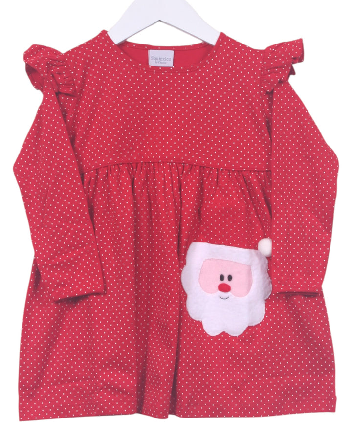 Red dress with white polka dots and Santa Claus face on a hanger