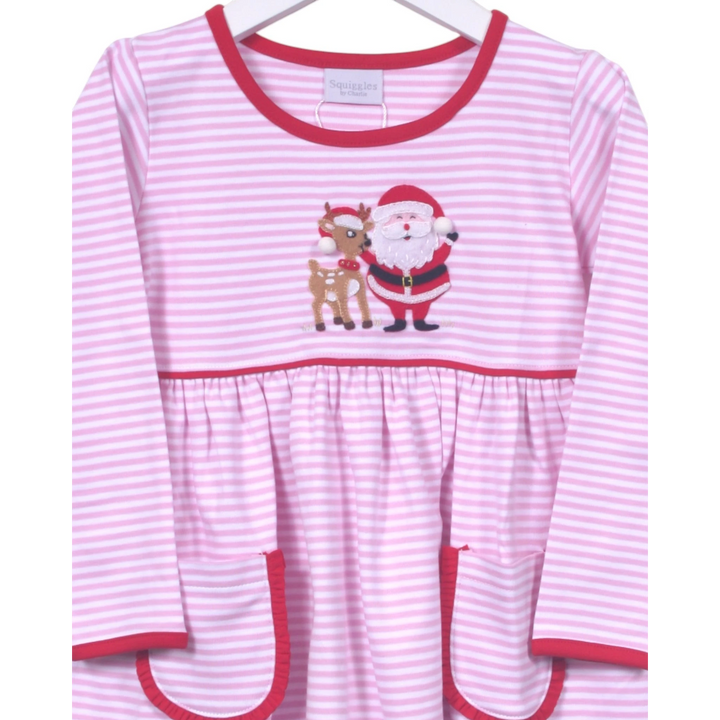 Pink and white striped dress with Santa and reindeer design on a hanger