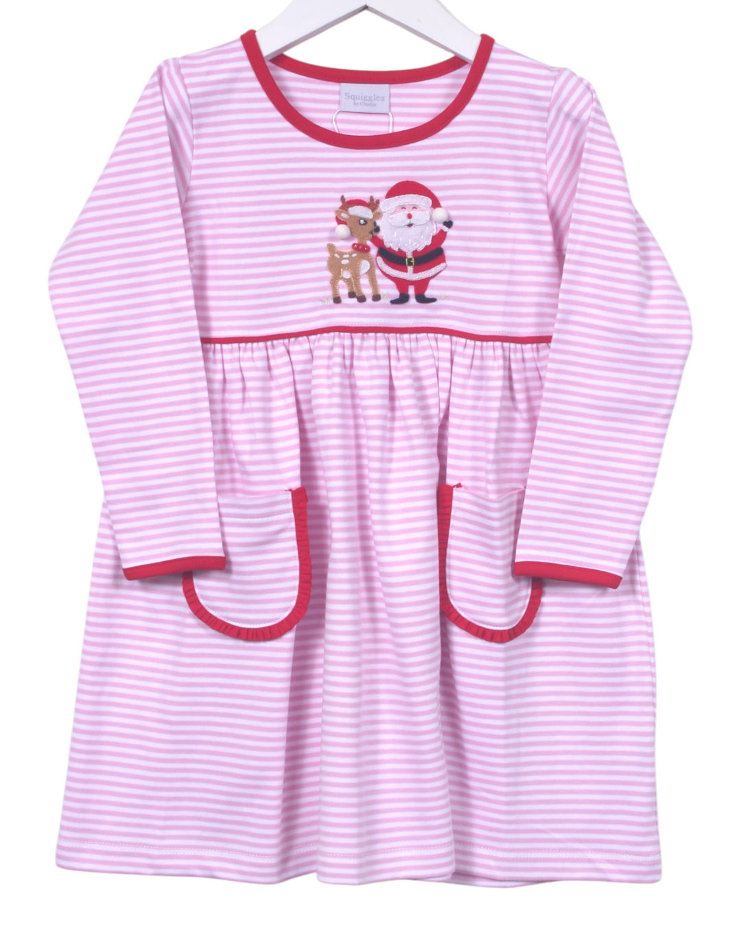 Pink and white striped dress with Santa and reindeer design on a hanger