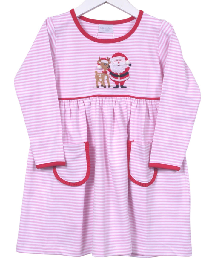 Pink and white striped dress with Santa and reindeer design on a hanger