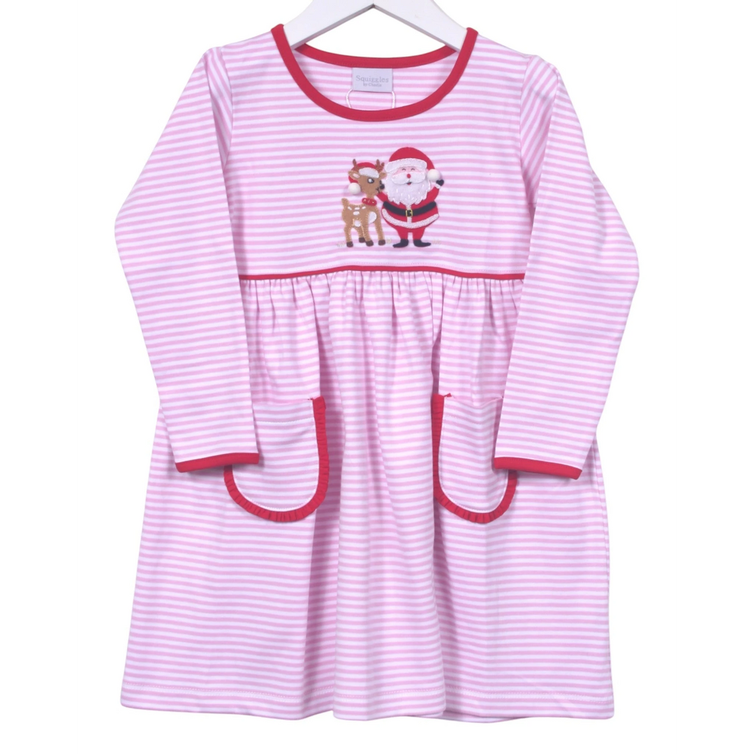 Pink and white striped dress with Santa and reindeer design on a hanger