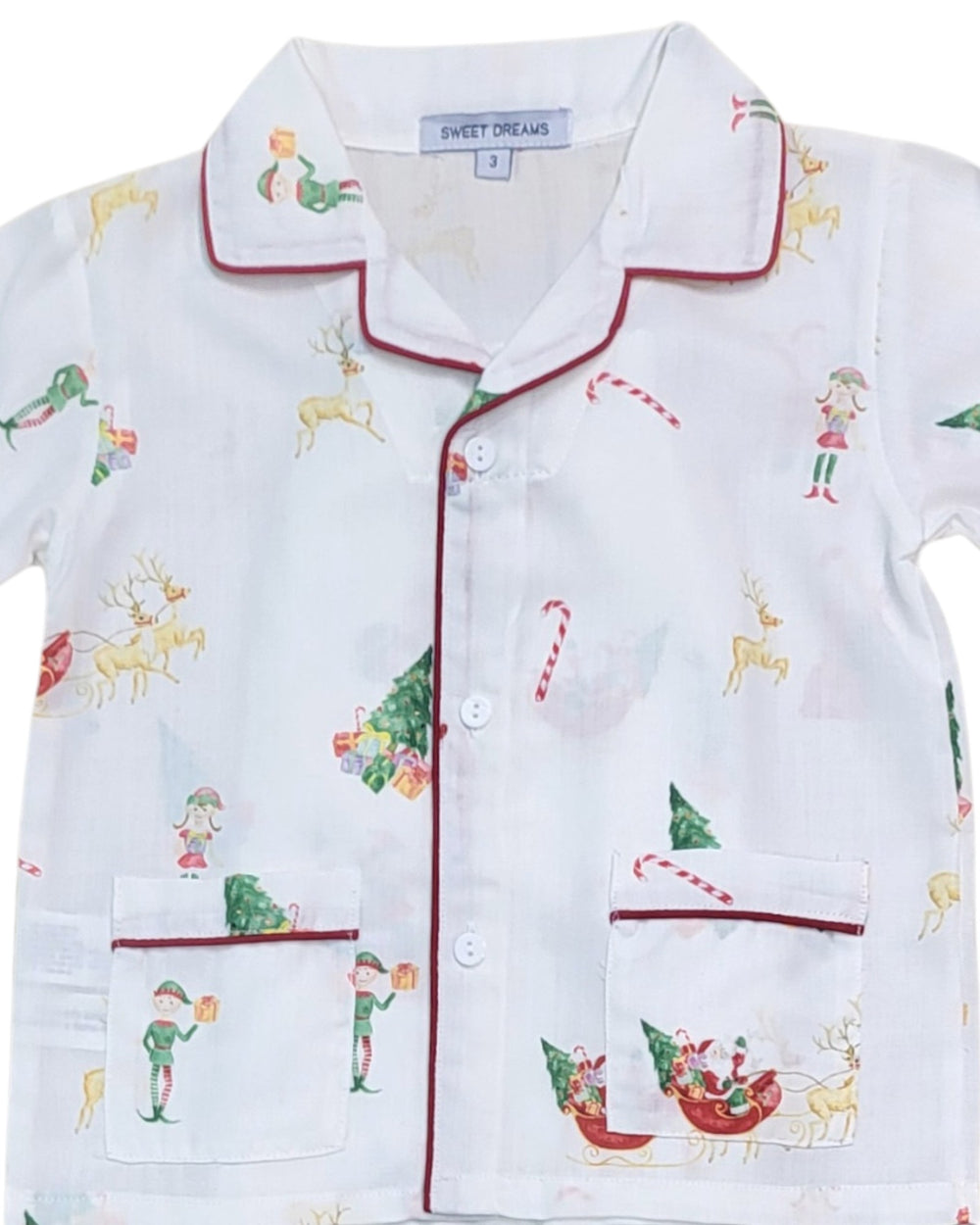 Children's pajama top with Christmas-themed design on a white background