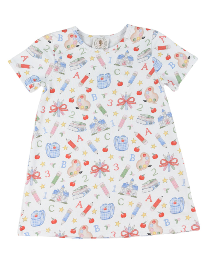 Children's dress with colorful school-themed pattern on a white background