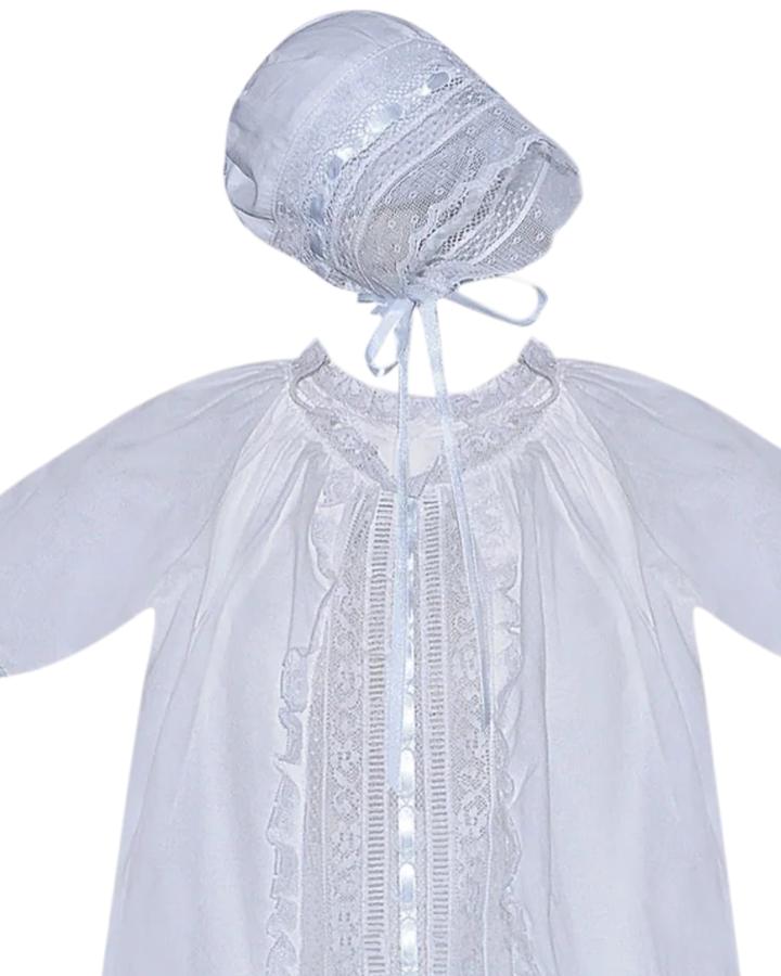 White lace baby outfit with bonnet on a white background