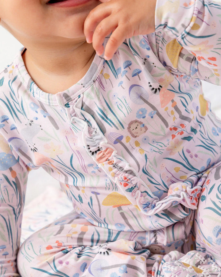 Child wearing a colorful pajama with animal prints