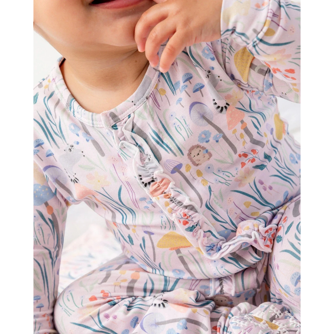 Child wearing a colorful pajama with animal prints
