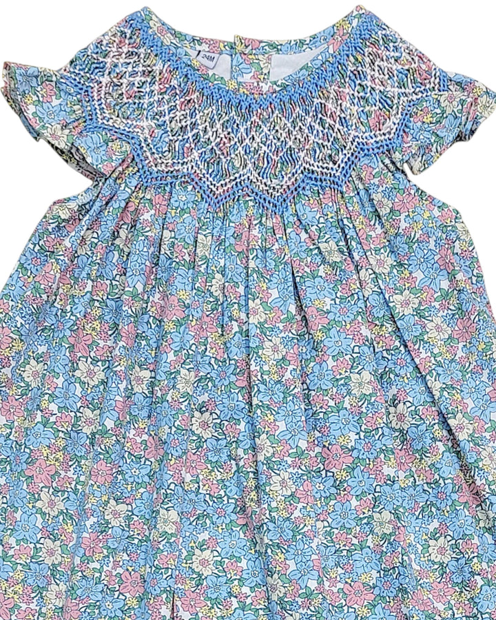 Floral dress with smocked neckline on a white background, that store