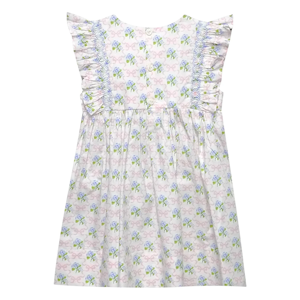 Floral dress with ruffled details on a white background