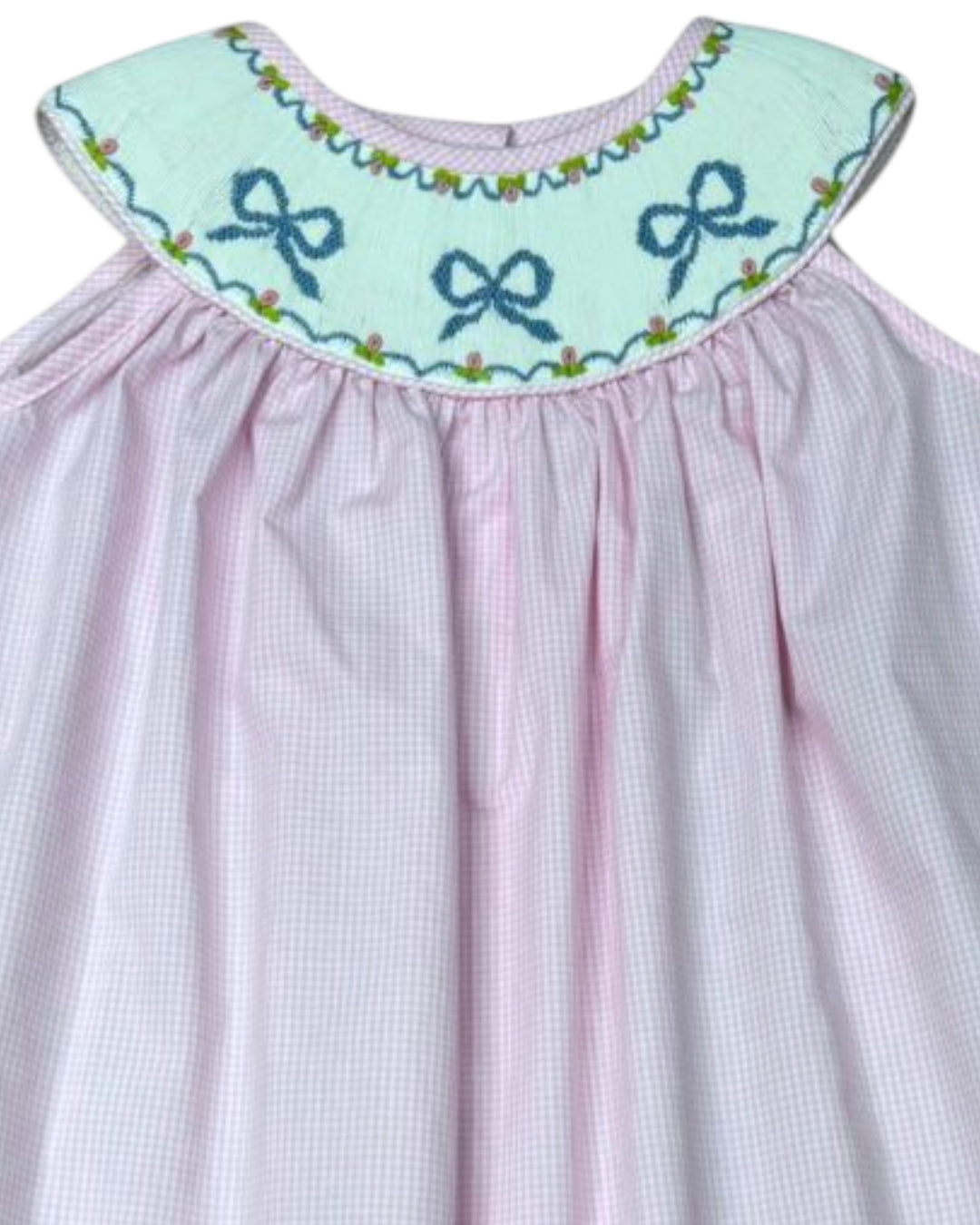 Pink checkered dress with embroidered blue bows on a light blue collar against a white background