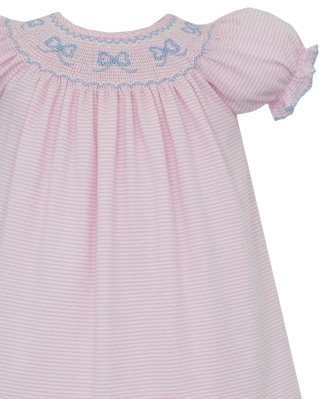 A close-up of a baby dress with light pink and white vertical stripes, featuring smocked bodice with blue bow details and ruffled short sleeves, that store