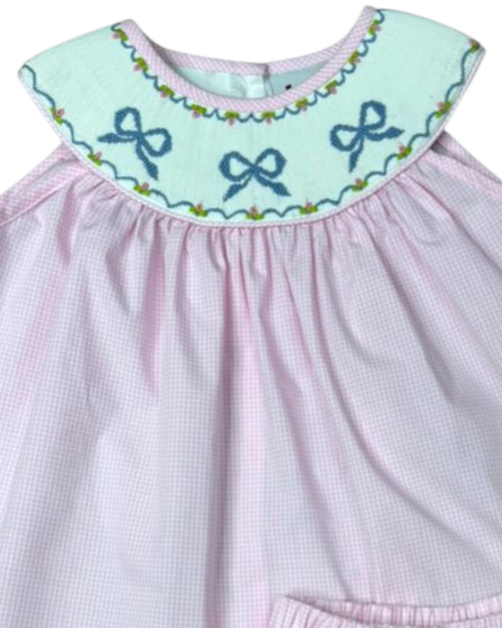 Pink dress with a light blue collar featuring embroidered bows on a white background