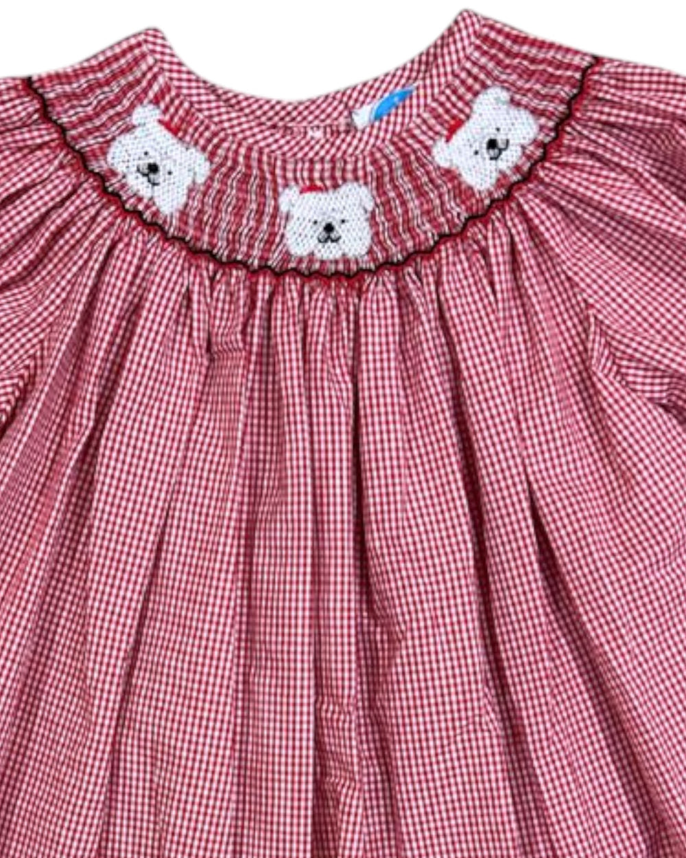 Red checkered dress with white bear face designs on a white background