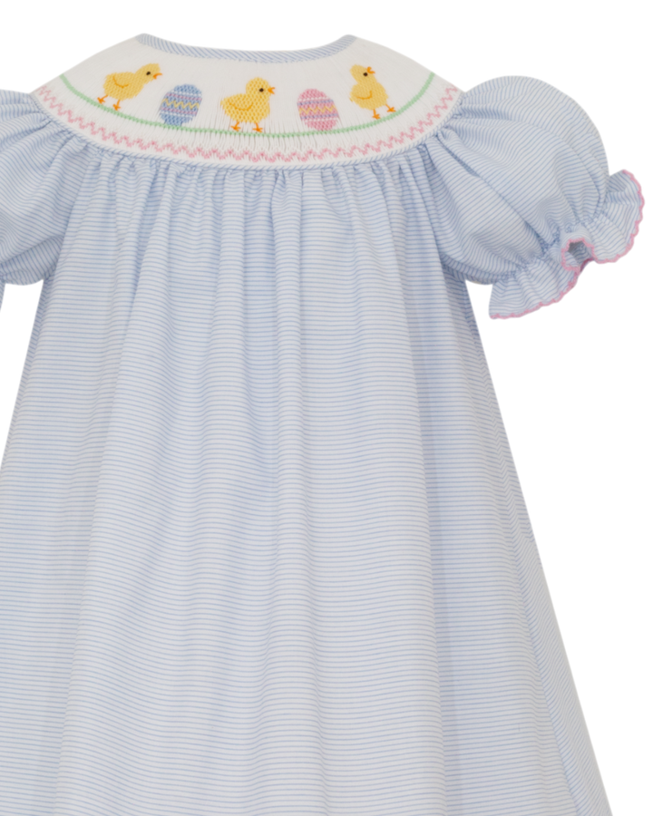 Light blue dress with smocked collar featuring chicks and eggs on a white background