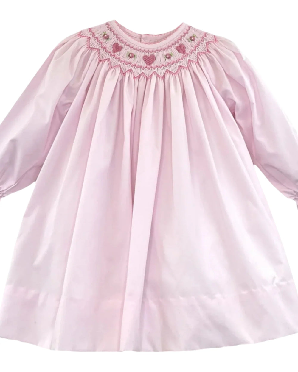 Pink dress with smocked neckline on a white background