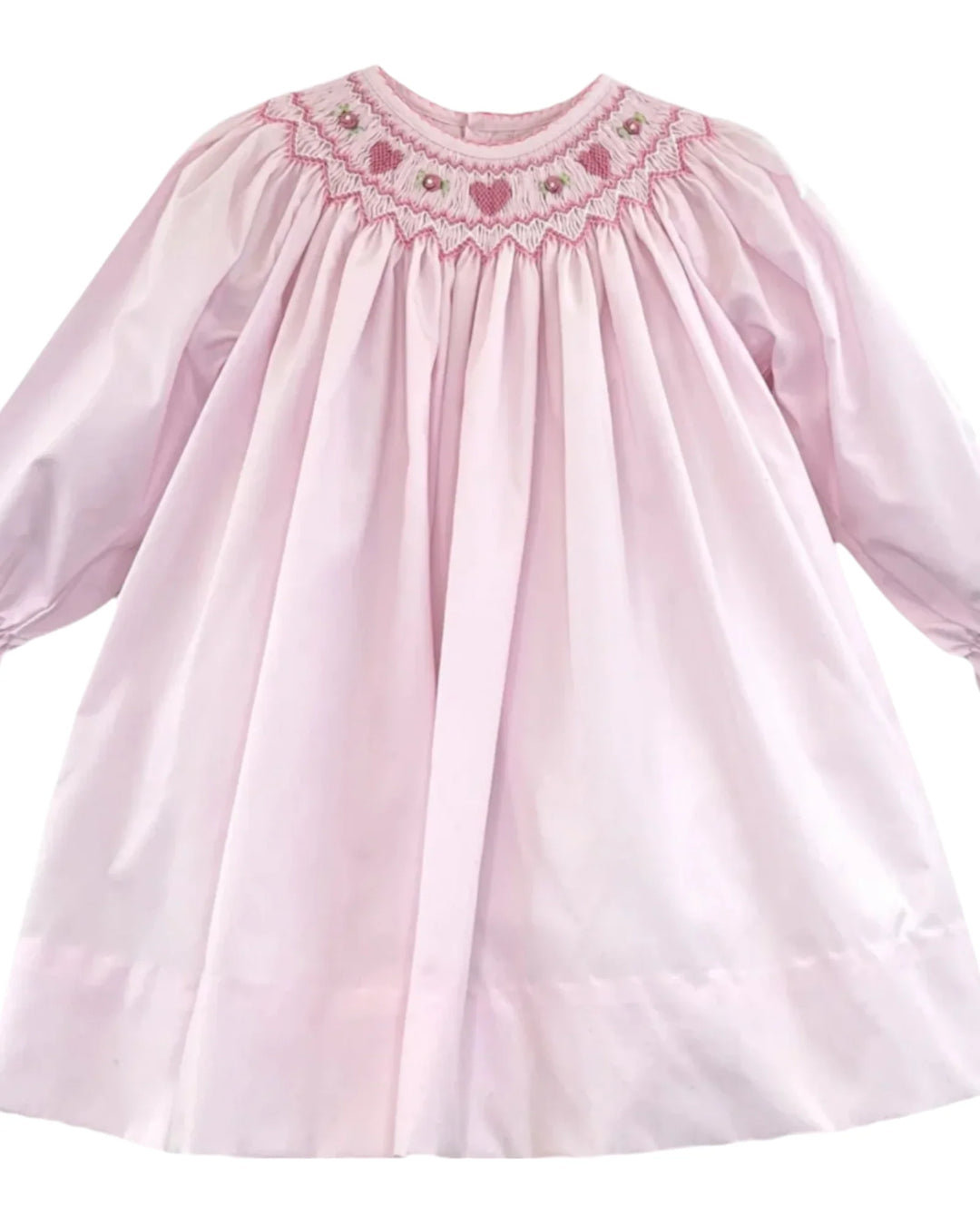 Pink dress with smocked neckline on a white background