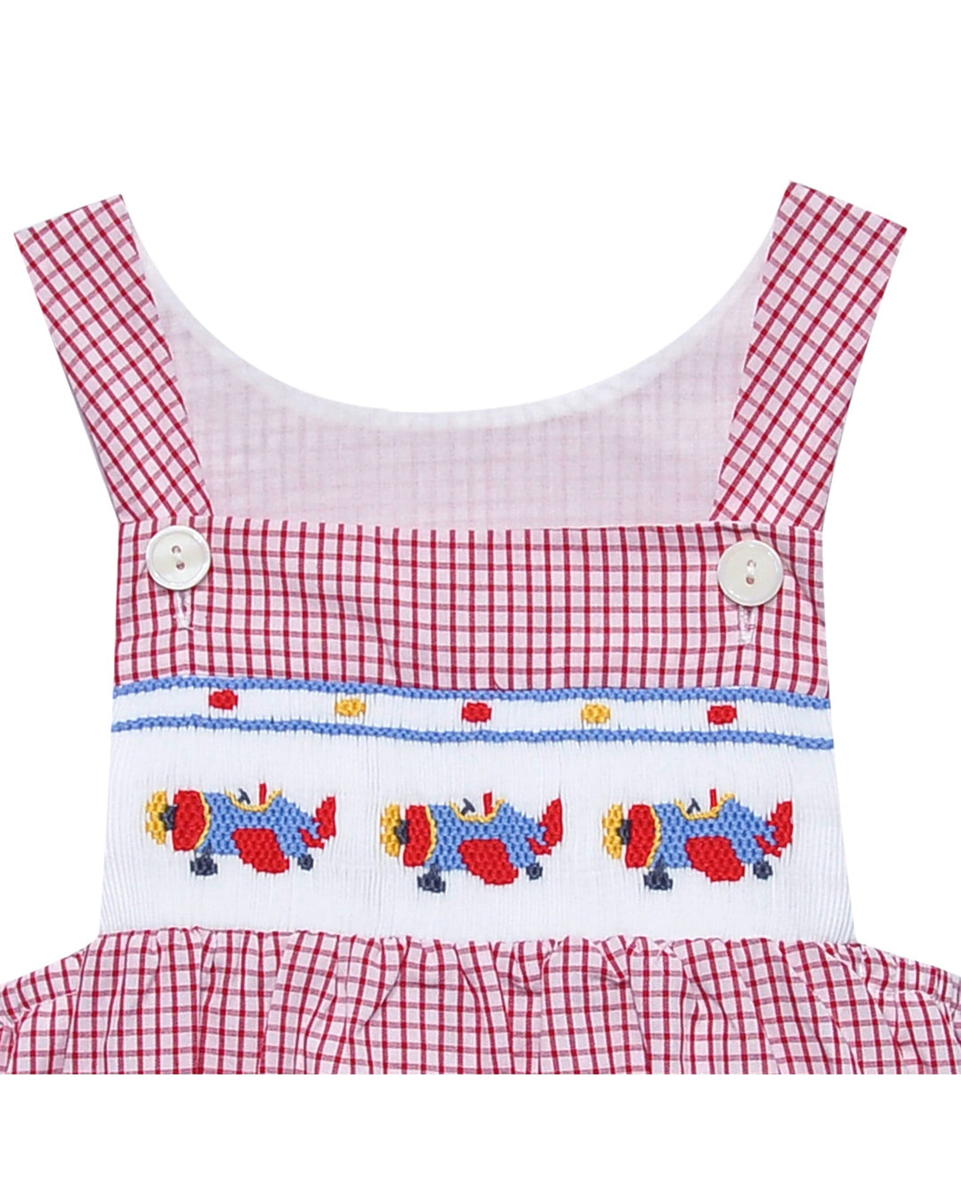 Red and white checkered dress with embroidered design on a white background, that store