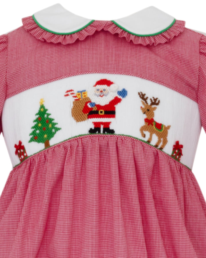 Red checkered dress with Christmas-themed embroidery featuring Santa Claus and reindeer on a white background.