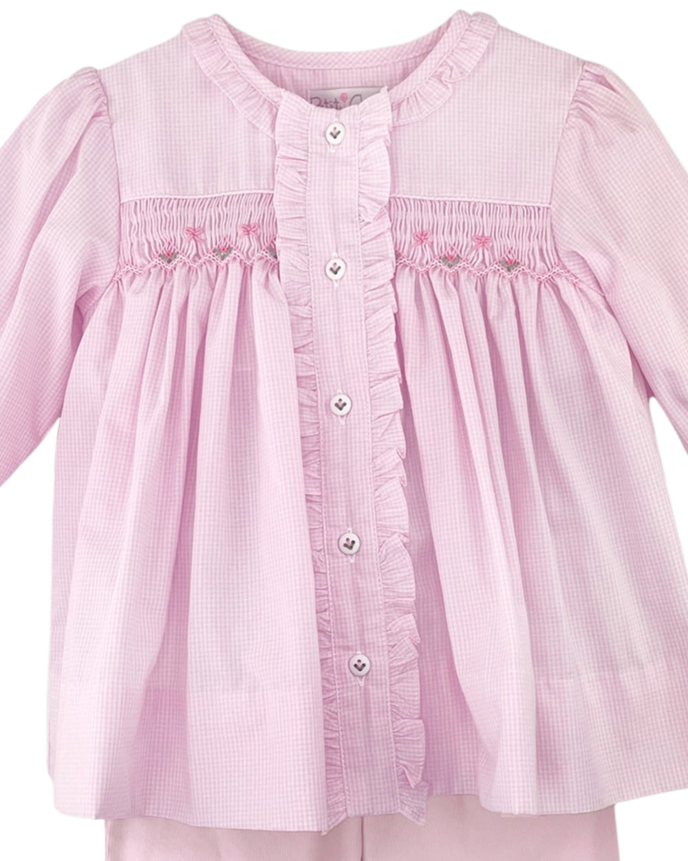 Pink checkered blouse with smocked details on a white background
