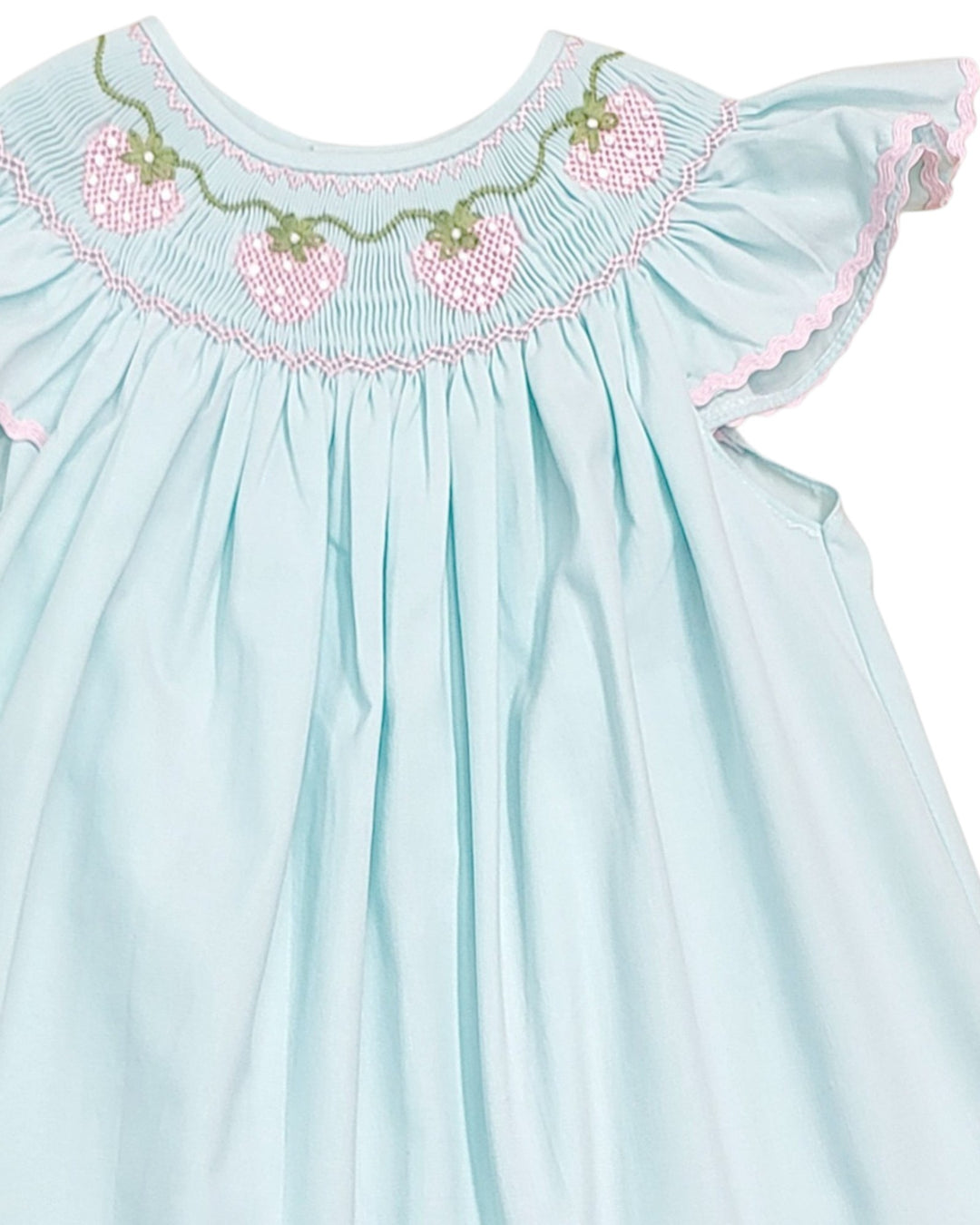 Light blue dress with embroidered details on a white background, that store