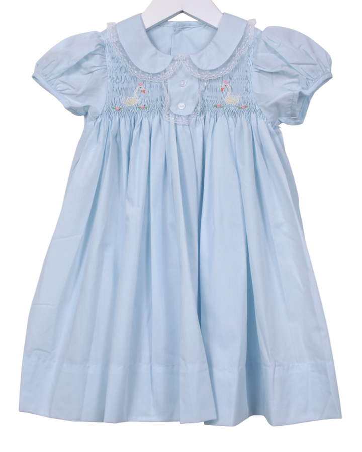 Light blue dress with smocked details on a white background