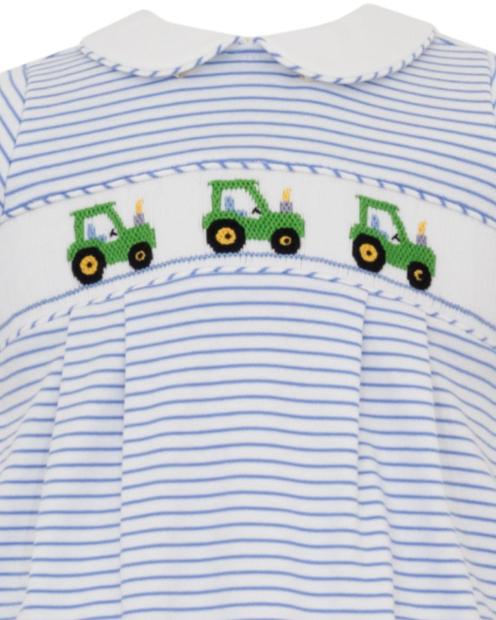 Striped shirt with smocked green tractor pattern on a white background