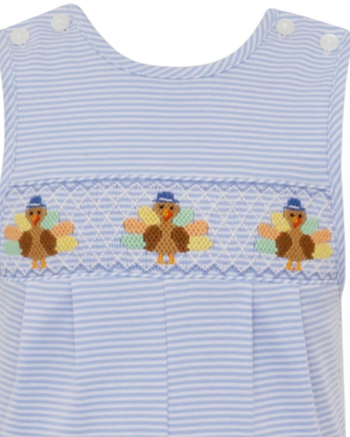 Blue striped dress with embroidered turkeys on a white background