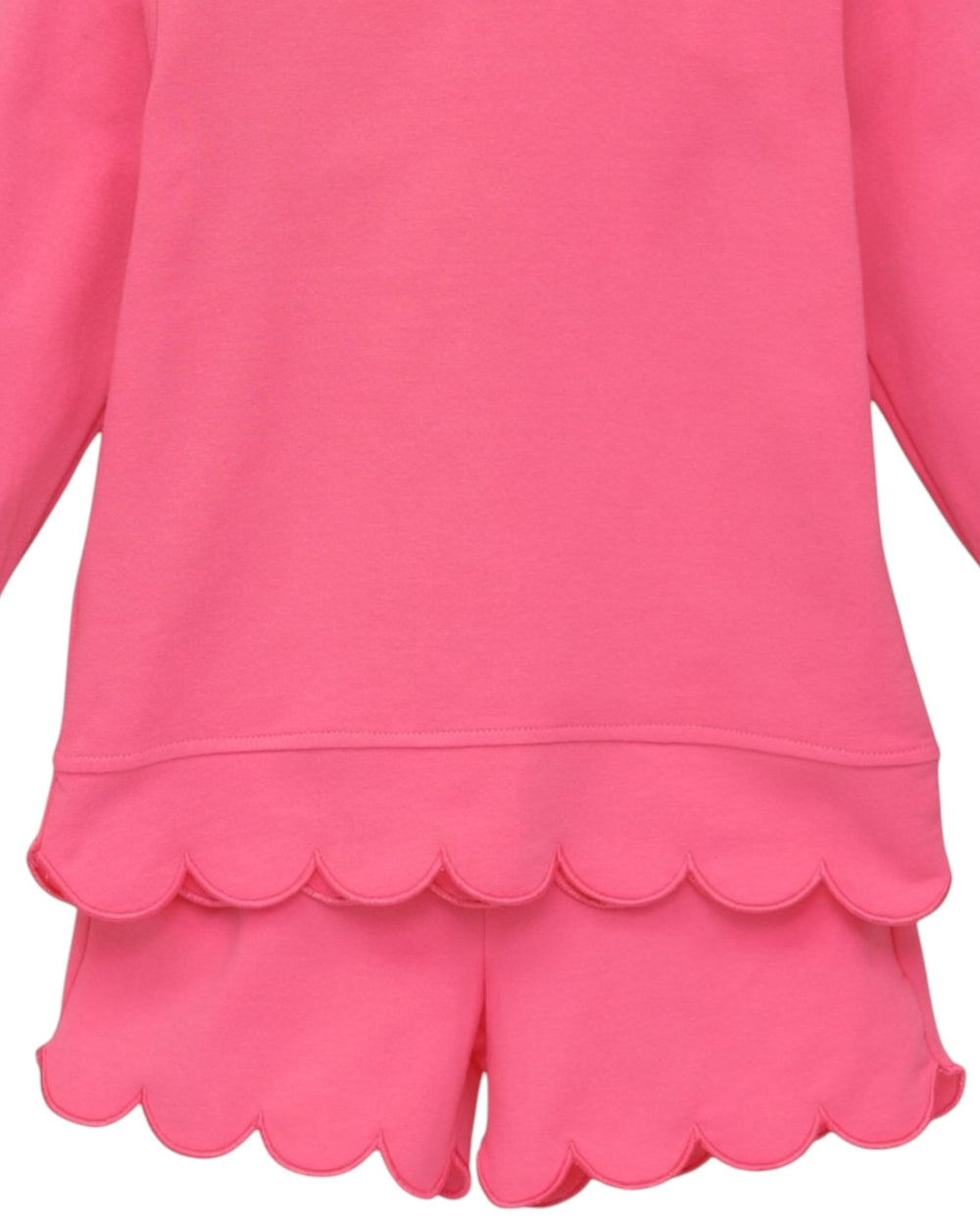 Bright pink long-sleeve top and matching shorts set with scalloped hems, shown on a white background, that store
