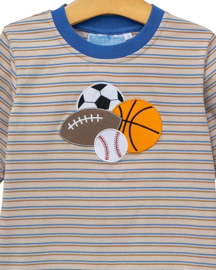 Striped shirt with sports ball appliqués on a hanger