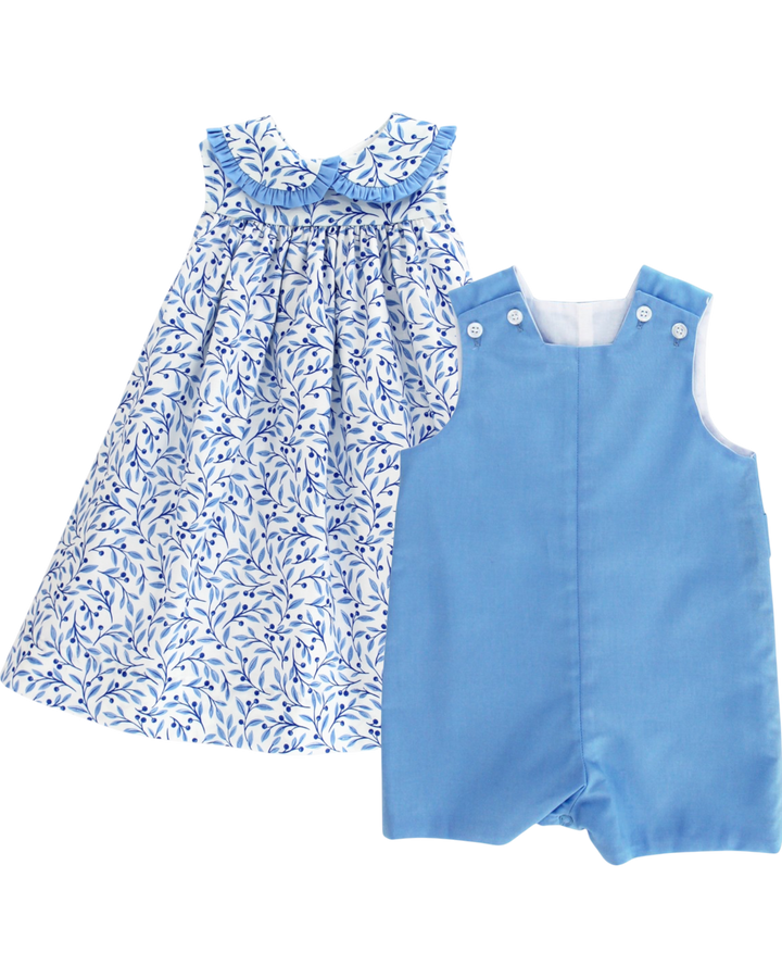 Blue floral dress and blue romper on a white background