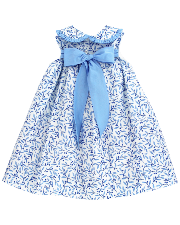 Blue floral dress with a large bow on a white background