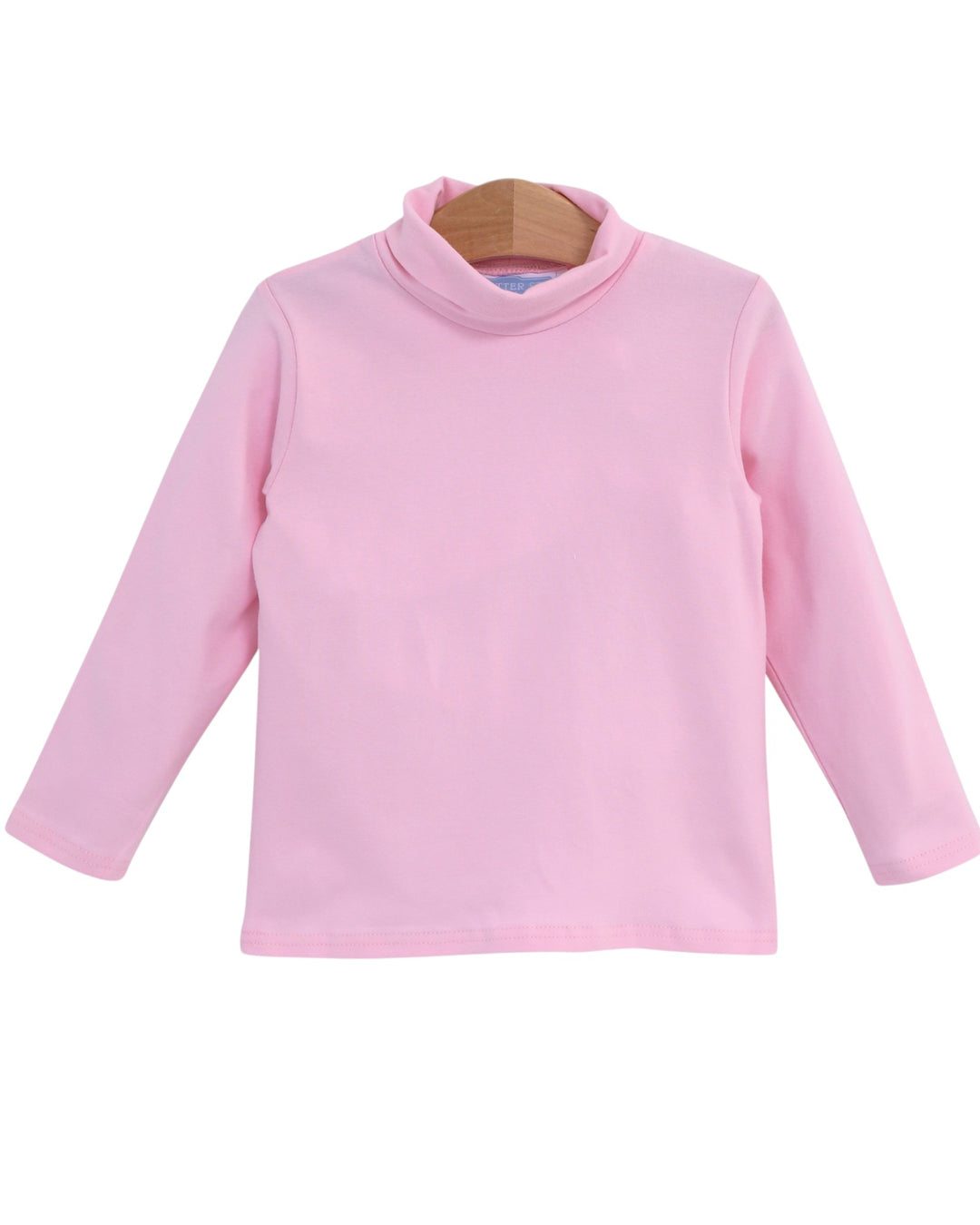 A light pink long-sleeve mock neck top displayed on a wooden hanger against a plain white background, that store