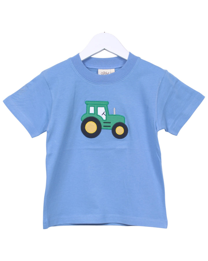Blue t-shirt with a green tractor graphic on a white background