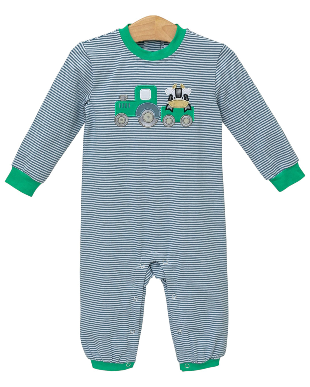 Striped baby romper with a green tractor design on a white background