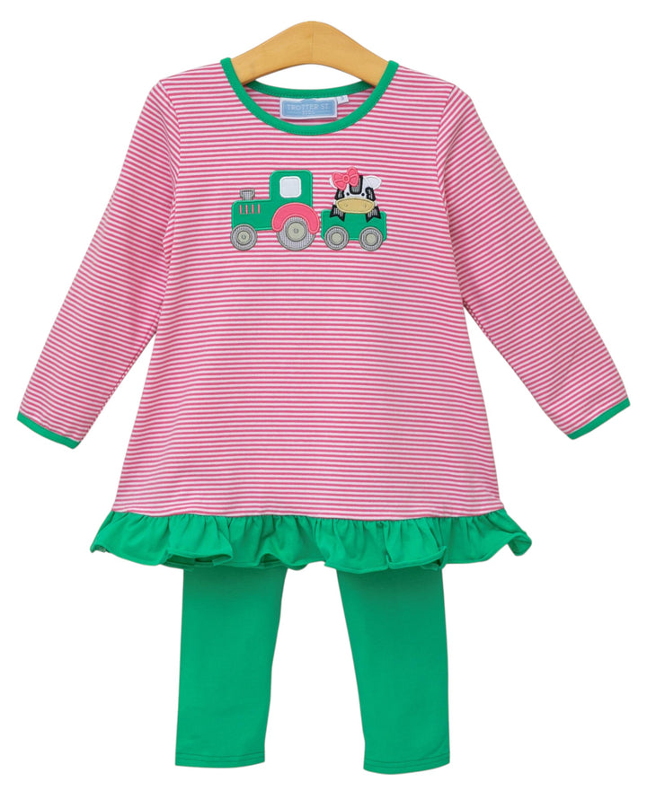 Pink and green striped dress with a train design on a hanger against a white background
